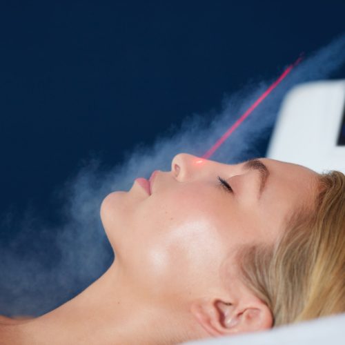 Localized cryotherapy on woman face